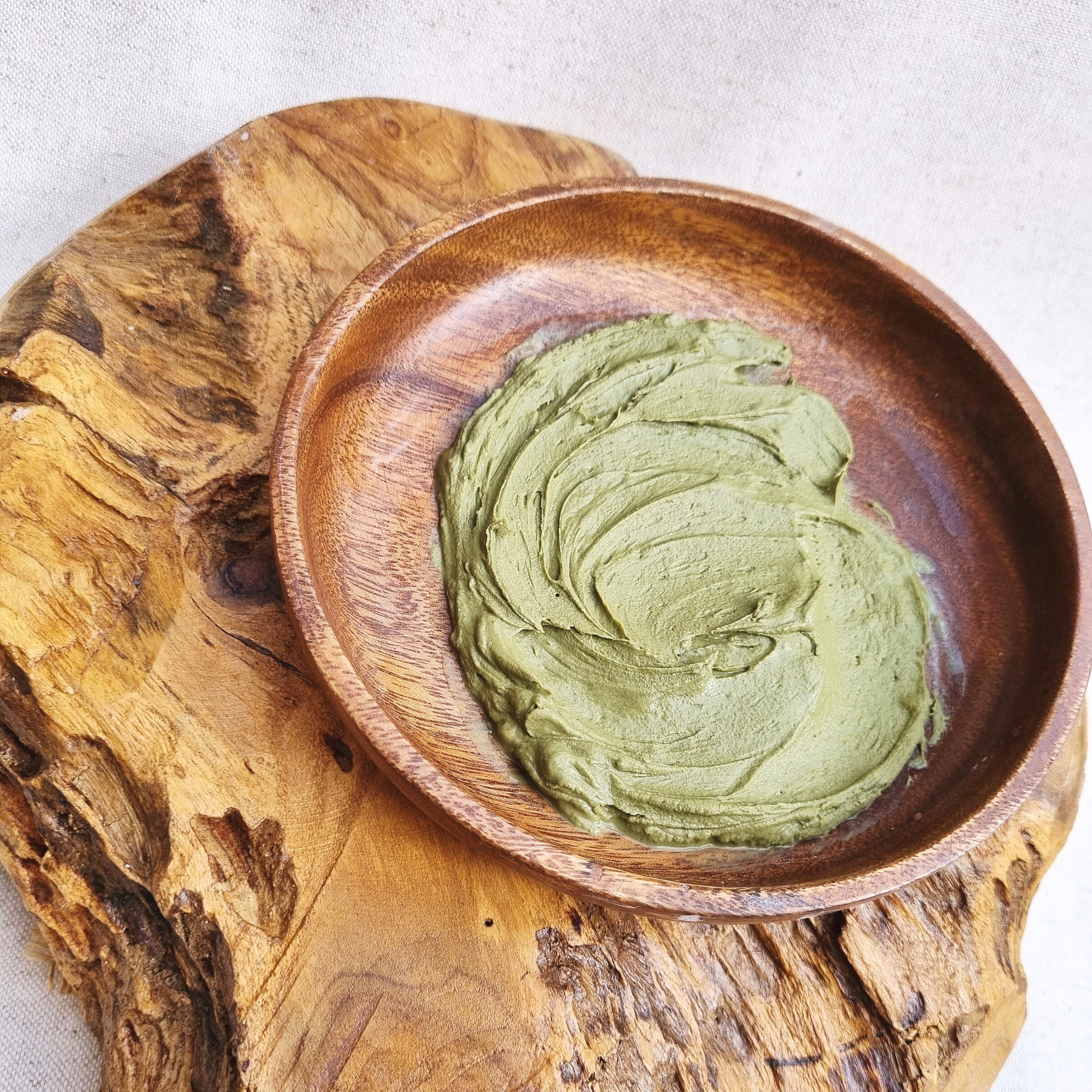 'Mask for days' Organic detoxification clay with bladderwrack seaweed and matcha green tea. Hydrated powder in acacia bowl.